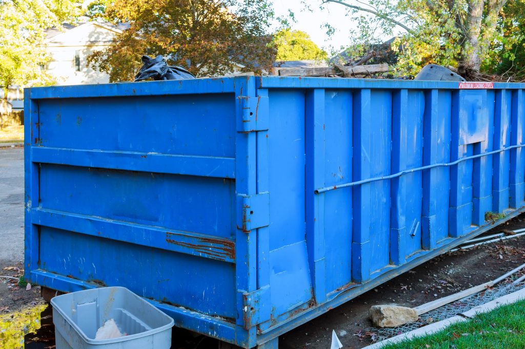 Dumpsters being full with garbage container Over flowing